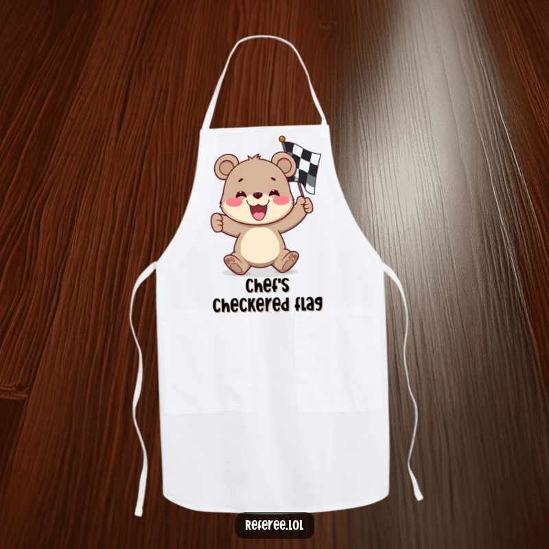 Funny bear cub apron, enthusiastically waving a checkered flag, ready to cook up a storm with a smile.