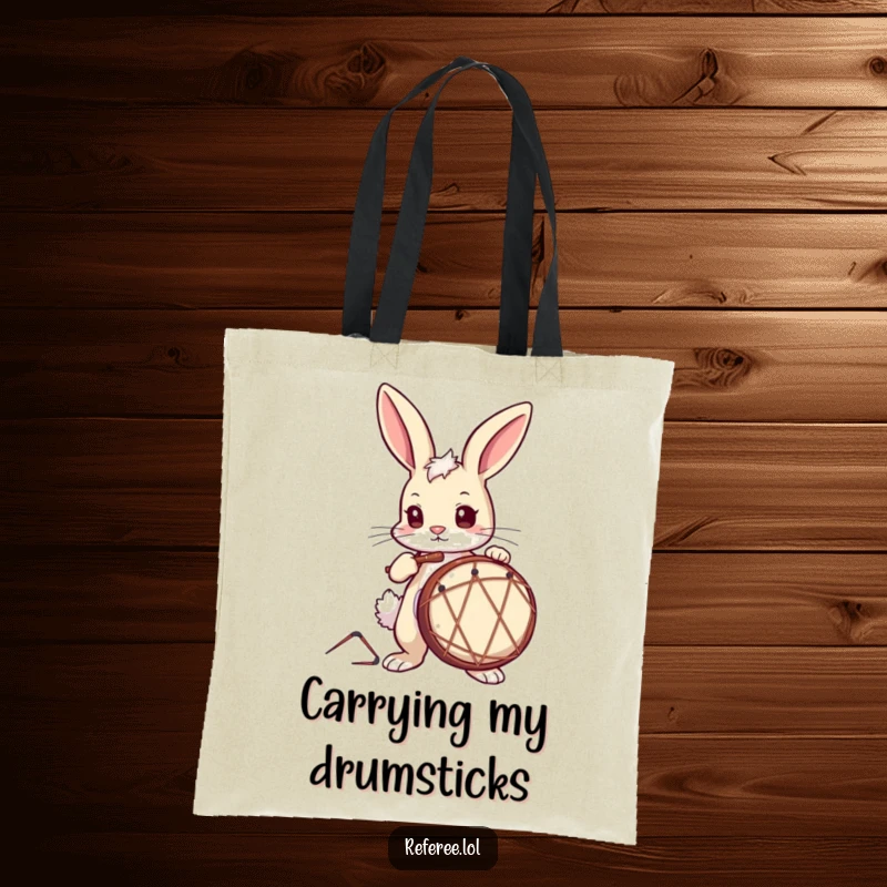 Funny Tote Bag featuring a curious bunny with a determined look, tapping a drum, great for music lovers.